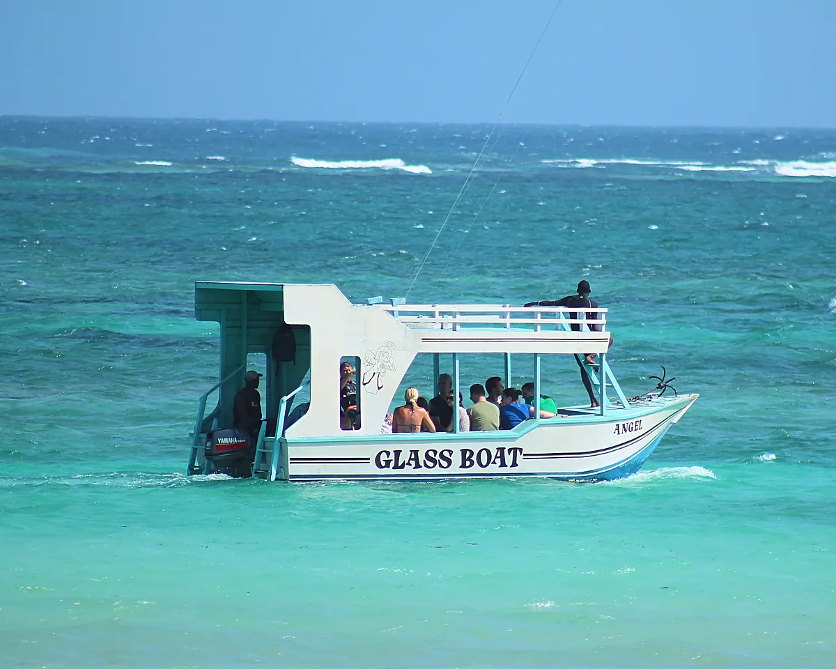 A glass-bottom boat on the water off Diani