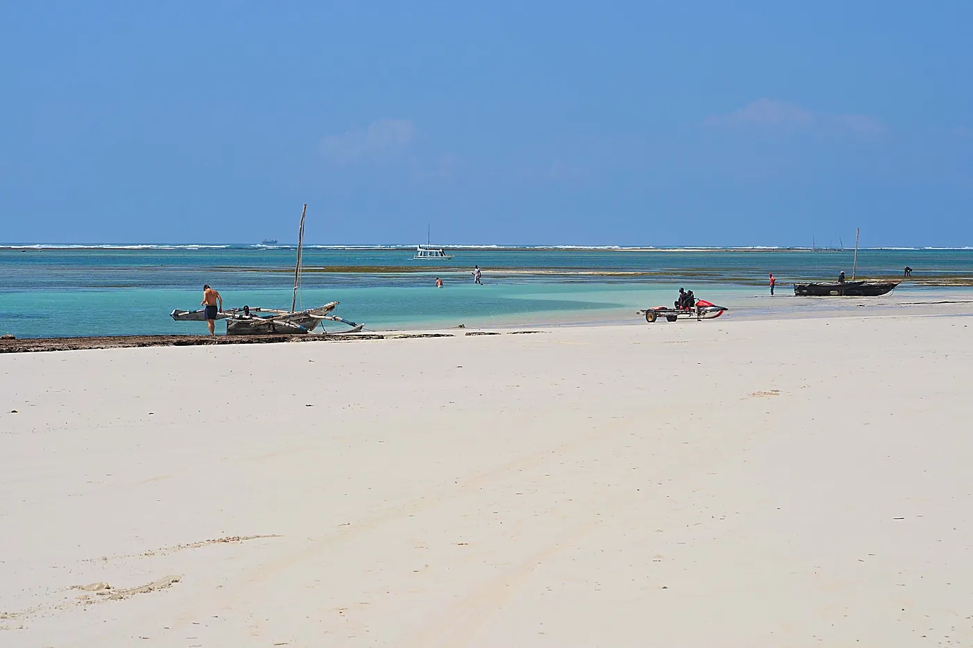 Dhows moored off a sandbar at low tide